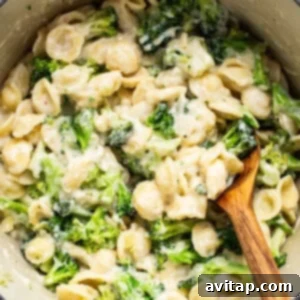 Velvety Broccoli Pasta 7 A pot of pasta with broccoli and cheese, freshly mixed and ready to serve.
