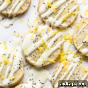 Lemon Poppy Seed Shortbread 11 Lemon poppy seed cookies being drizzled with white chocolate.