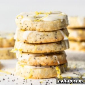 Lemon Poppy Seed Shortbread 6 Lemon poppy seed cookies with icing and sprinkles.