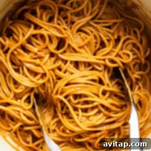 Quick Peanut Noodles in 20 Minutes 9 Spaghetti in a pot with two forks.