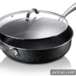 A black pot with a lid on a white background, representing an ideal skillet for one-pot meals.