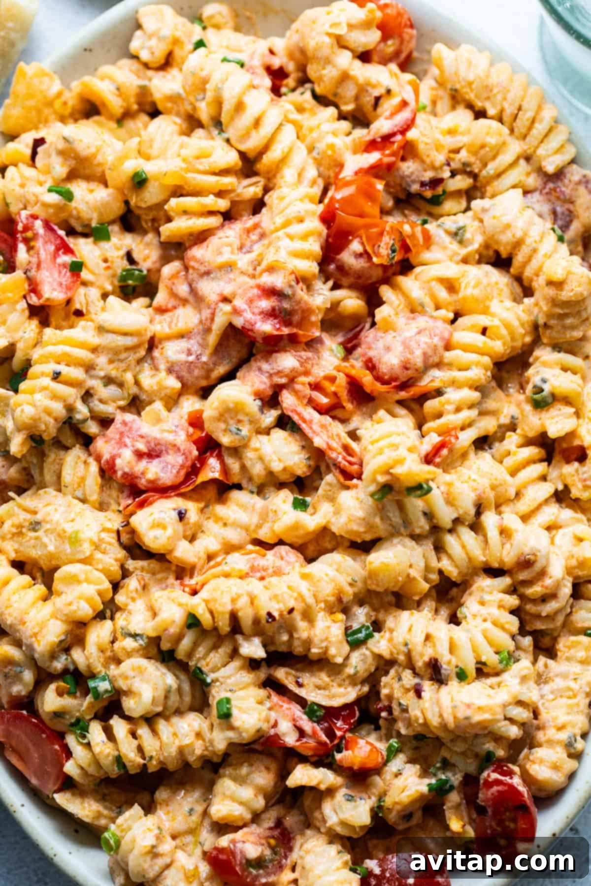 Creamy pasta salad with shrimp and diced vegetables.
