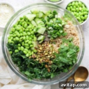 A hearty bowl of Green Goddess Quinoa Salad, featuring a vibrant mix of fresh greens, fluffy quinoa, and various healthy toppings, beautifully presented for serving.