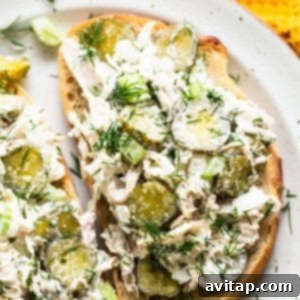 Tangy Dill Pickle Chicken Salad 11 Dill pickle chicken salad served on toasted bread slices, garnished with fresh dill, ready for eating.