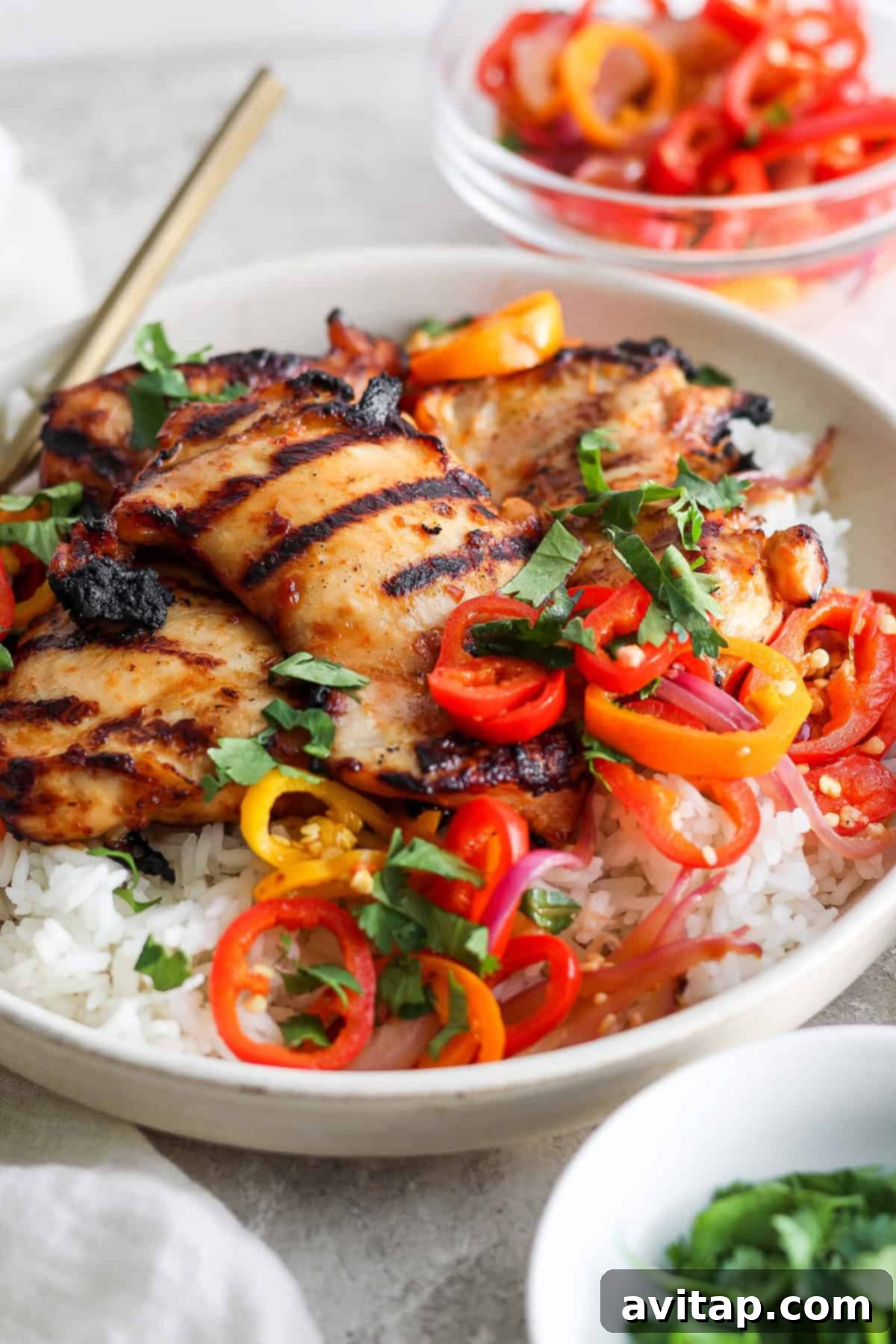 Tropical Grilled Coconut Chicken 6 Overhead shot of grilled coconut chicken with fresh cilantro and lime.