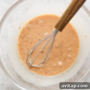 Mixing marinade ingredients in a bowl.