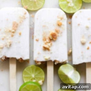 Frozen Coconut Key Lime Pie Popsicles in their molds.
