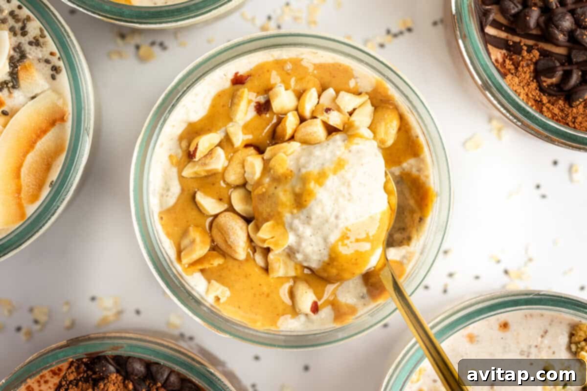 A bowl of creamy oatmeal topped with peanut butter and chopped nuts. A gold spoon is partially submerged in the oatmeal. Other bowls of similarly prepared oatmeal surround it, creating an inviting breakfast scene.