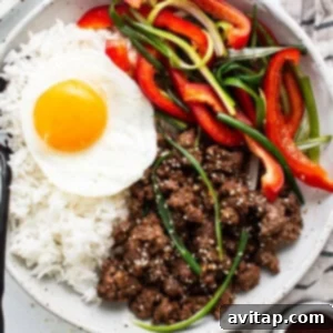 A vibrant bowl of Korean Ground Beef, garnished with fresh green onions and sesame seeds, reflecting a delicious and easy meal option.