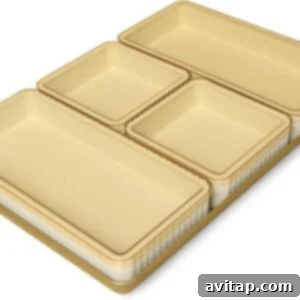 Four rectangular beige nested storage containers in different sizes, arranged neatly on a flat surface—perfect for organizing ingredients before your sheet pan Thanksgiving dinner.