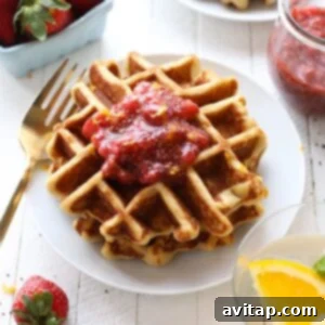 A beautifully plated gluten-free waffle, golden and fluffy, ready to be served.