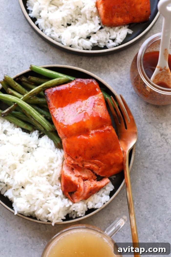 Honey Sriracha Salmon served with rice and green beans, a complete protein-packed meal.