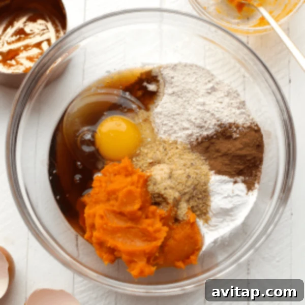 A bowl of roasted sweet potato pieces and other ingredients, suggesting preparations for sweet potato puree or dishes using it.