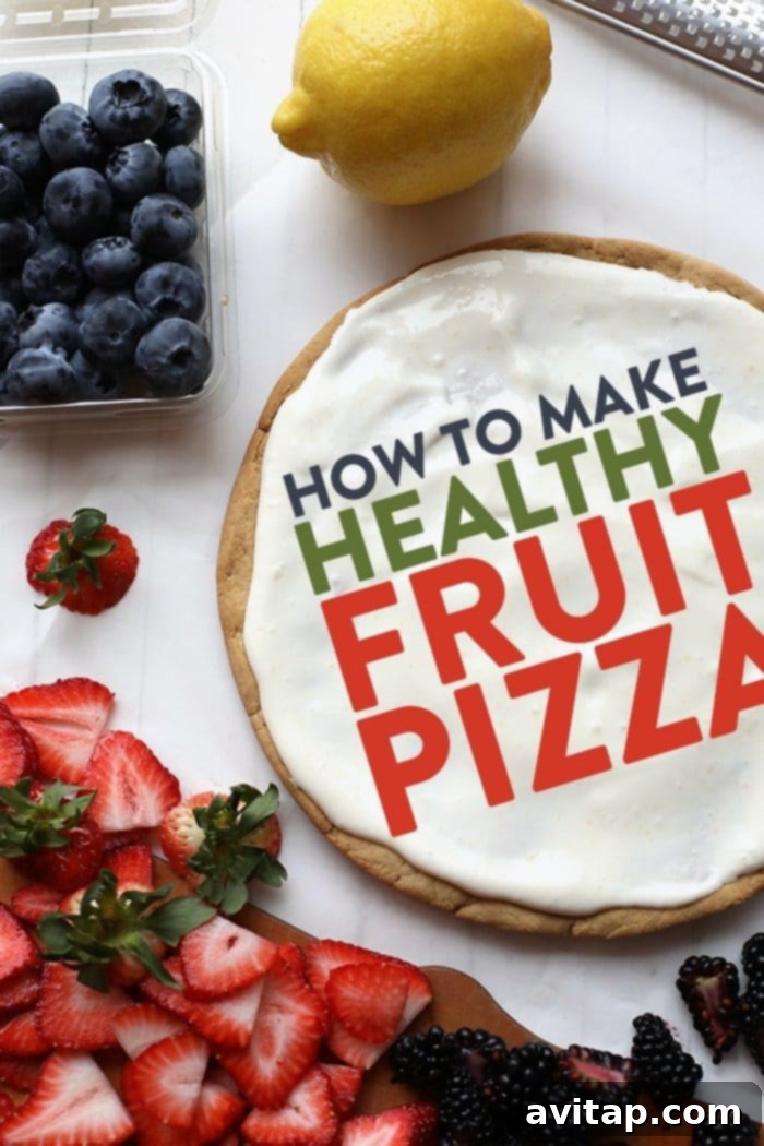 The golden-brown, grain-free sugar cookie crust for fruit pizza, cooling on a baking sheet.