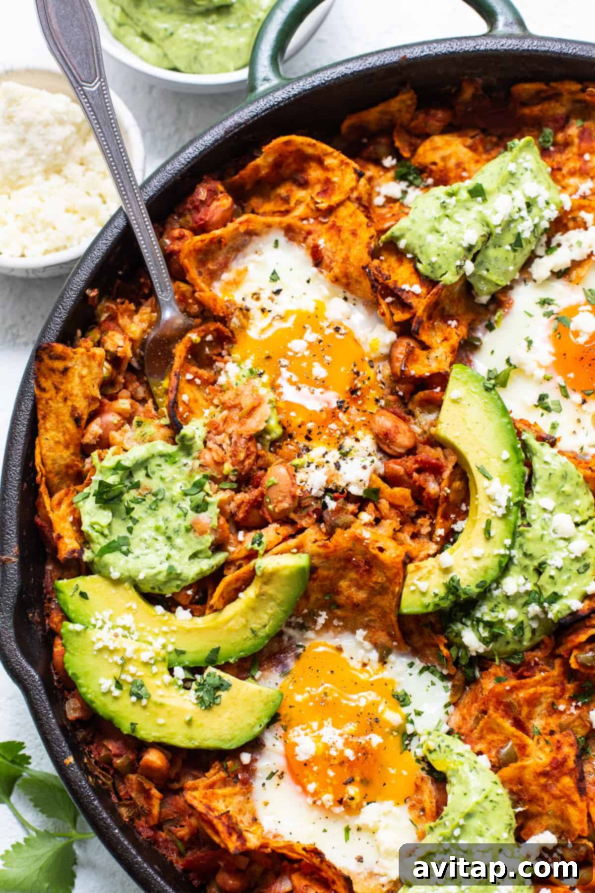Freshly Made Chilaquiles Chilaquiles served in a cast iron skillet.