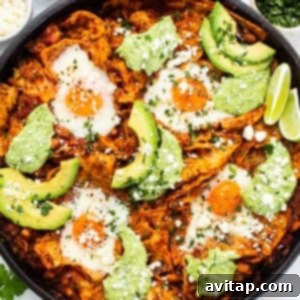 Chilaquiles simmering in a pan, ready for the oven.