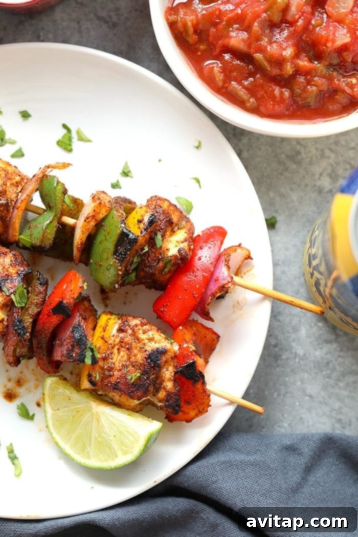 chicken fajita kabobs on plate.