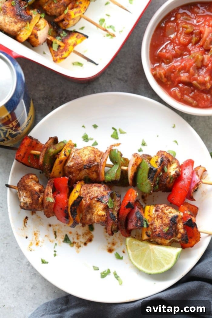 chicken fajita kabobs on plate.