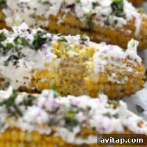 Mediterranean-style street corn grilled with parmesan cheese and herbs.