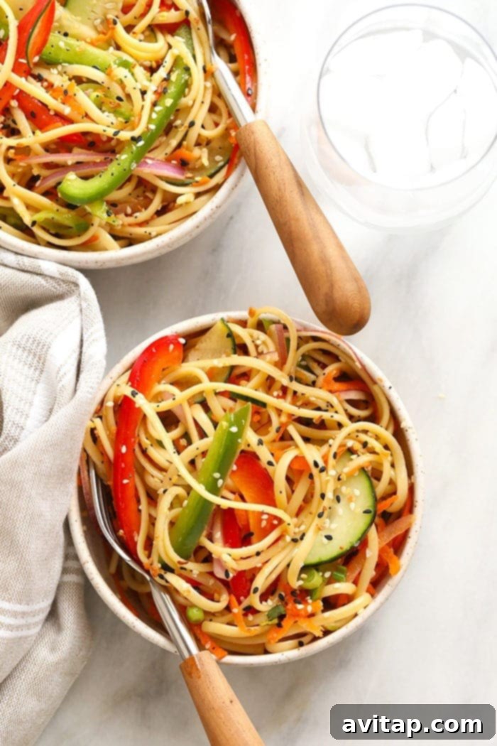 Overhead shot of a chilled Asian Noodle Salad in a decorative bowl, highlighting the colorful medley.