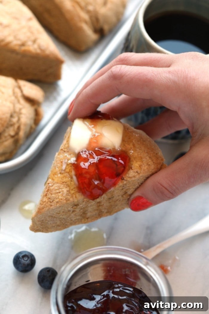 Hearty Whole Wheat Scones 7 Beautifully baked Honey Whole Wheat Scones, a wholesome and dairy-free treat from the Love Real Food Cookbook, perfect for sharing.