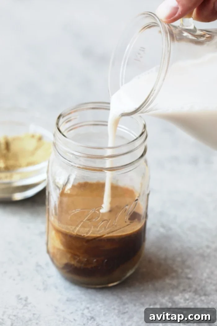 A tall glass of homemade cold brew protein drink, ready to be enjoyed after a workout.