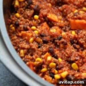 A slow cooker filled with Mexican quinoa after cooking.