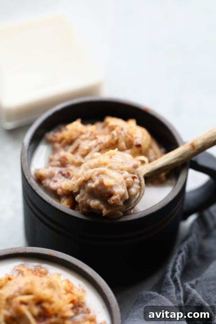 A spoonful of creamy steel cut oatmeal, highlighting its hearty texture and perfect for a healthy start to the day.