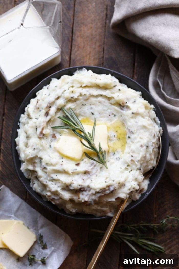 Healthy Mashed Potato Perfection 2 Beautifully served healthy mashed potatoes in a rustic bowl, garnished with fresh herbs and a pat of melted butter, ready to be enjoyed.