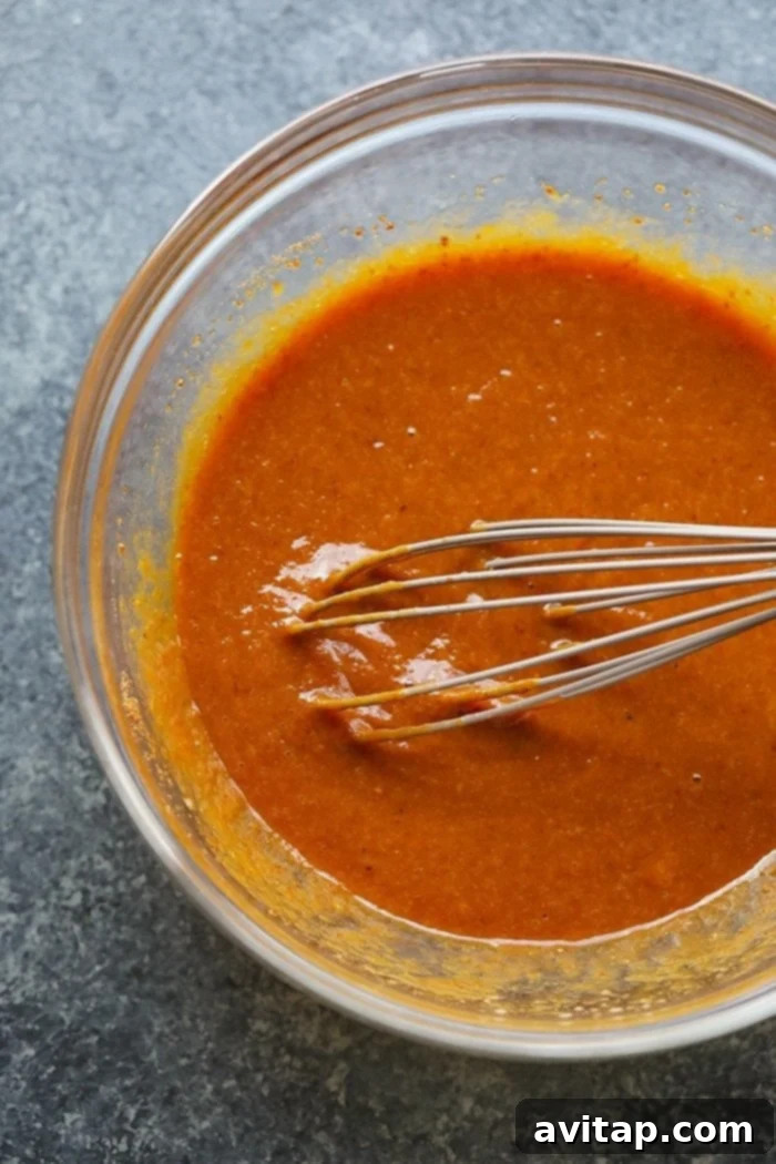 Pumpkin muffin batter in a bowl