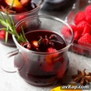 spiced raspberry mulled wine in a glass mug