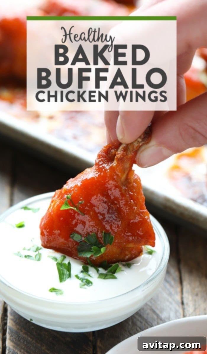 Healthy baked buffalo chicken wings with celery and blue cheese dip