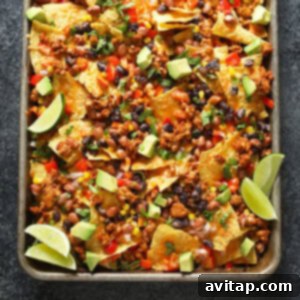 Baked nachos with ground beef and toppings