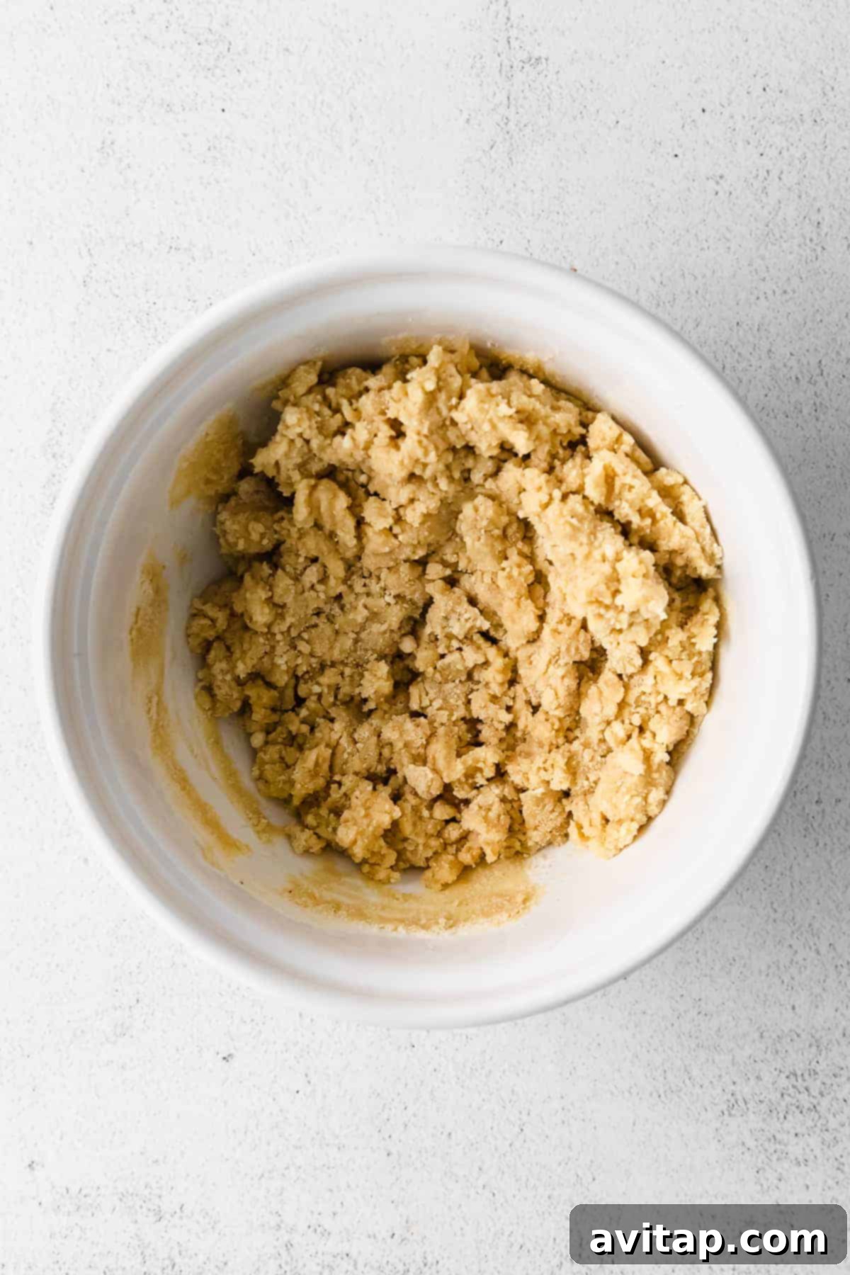 Smooth and pliable almond flour cookie dough in a mixing bowl, ready for chilling.