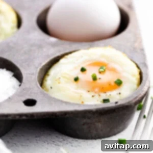 Close-up of baked eggs in a muffin tin, illustrating the ease of making perfect, high-protein egg cups.