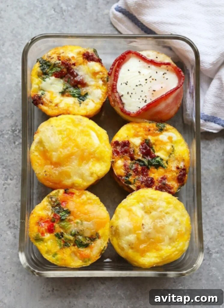 Healthy breakfast egg cups neatly arranged in a meal prep container, ready for the week ahead.