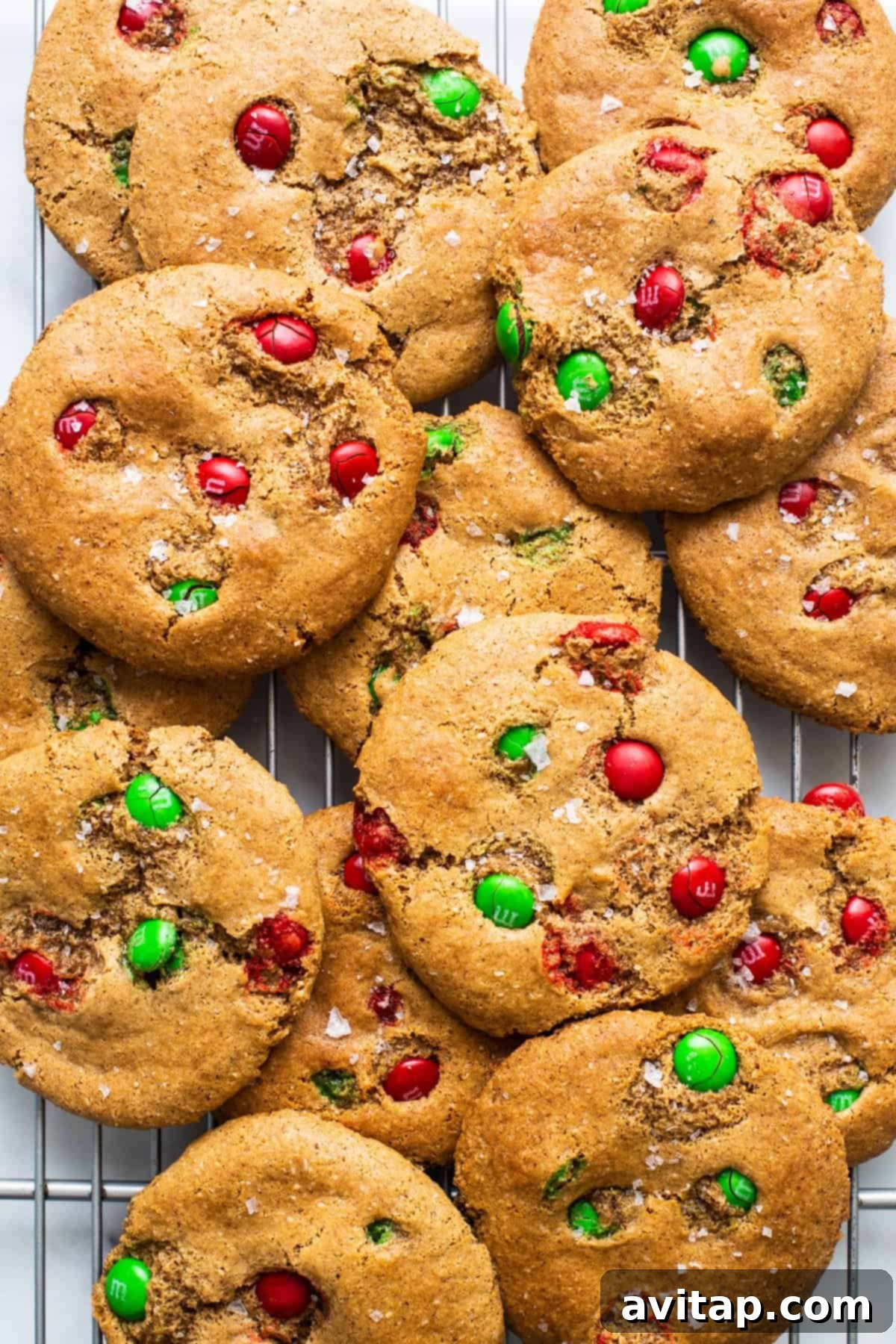 M&m cookies on a cooling rack, showcasing their chewy texture and vibrant M&Ms.
