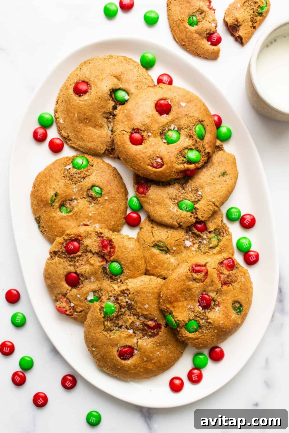 Christmas cookies on a festive plate, adorned with red and green M&Ms, ready for serving.