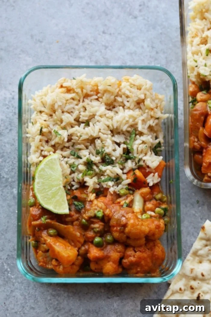 Cauliflower Tikka Masala prepared for convenient meal prepping. Meal-prepped Cauliflower Tikka Masala in a container, ready for a healthy lunch or dinner.