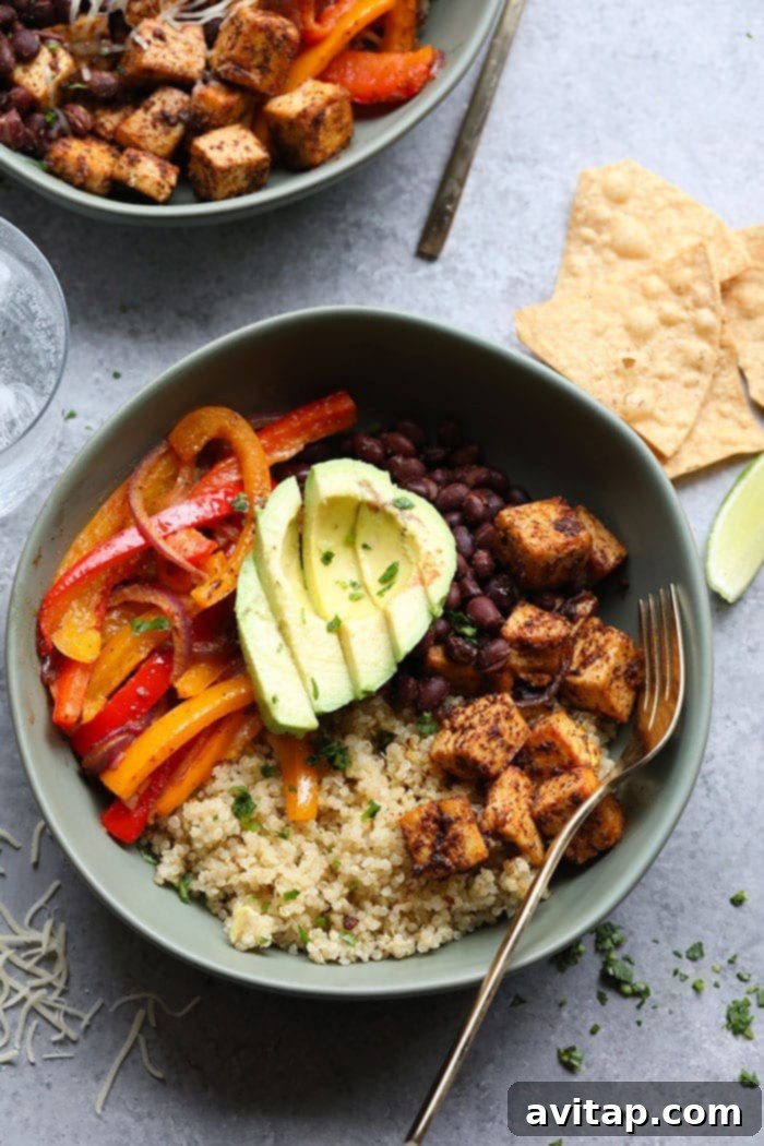 Individual Meal Prep Tofu Quinoa Burrito Bowls perfectly portioned and arranged, ready to be stored for quick, healthy meals throughout the week.