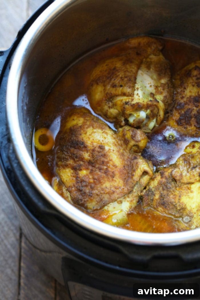 Moroccan Chicken Thighs cooking inside the Instant Pot