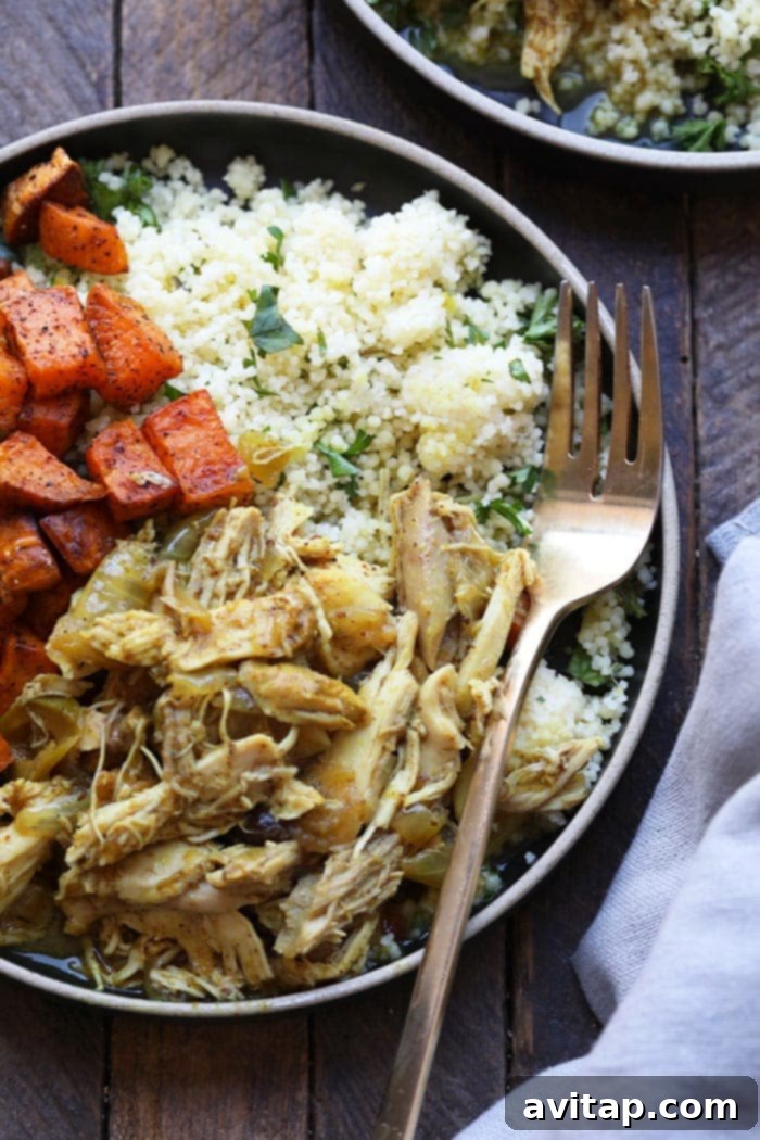 A vibrant plate of Moroccan Chicken with sweet potatoes and couscous