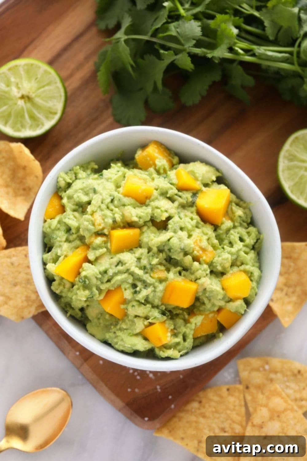 Gorgeous Ahi Tuna Tacos that are perfectly seared with sesame seeds and served with a citrus mango guacamole! mango guacamole in bowl