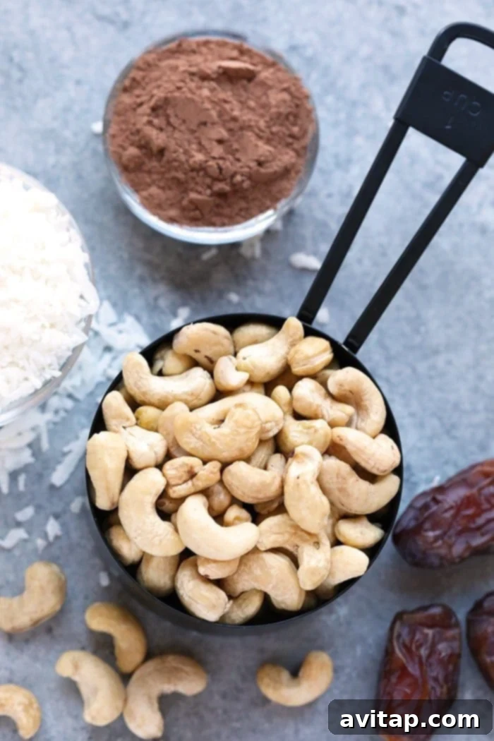 A close-up of a stack of No-Bake Chocolate Coconut Date Bars, showcasing their rich color and inviting texture, ready to be enjoyed as a wholesome snack.