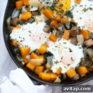 A breakfast skillet with butternut squash and eggs.