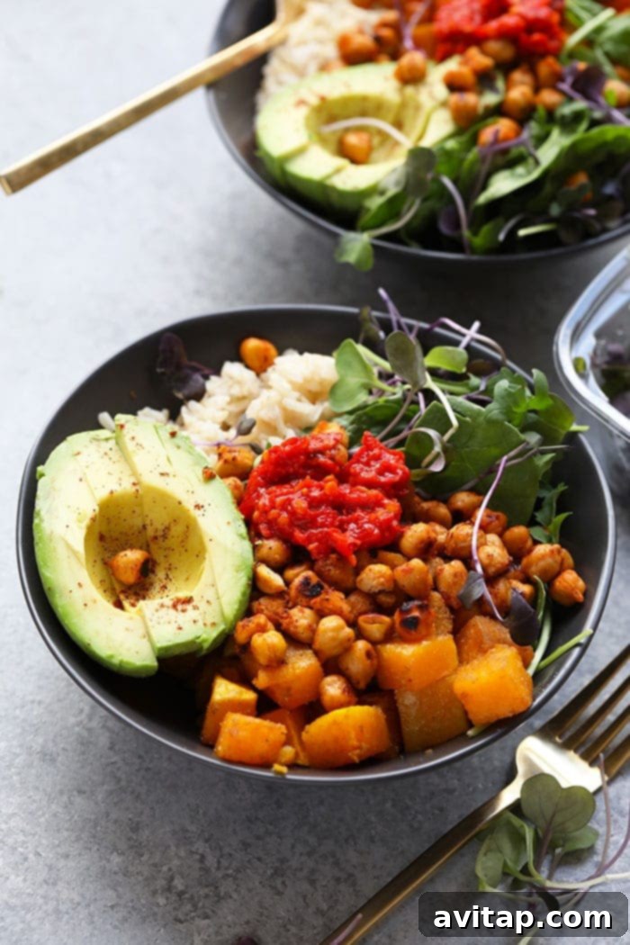 A selection of healthy Buddha bowls, assembled and ready for enjoyment, highlighting the ease of meal prepping this recipe.
