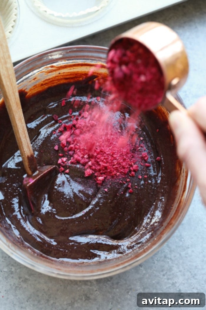 Preparing the batter for raspberry chocolate almond butter cups