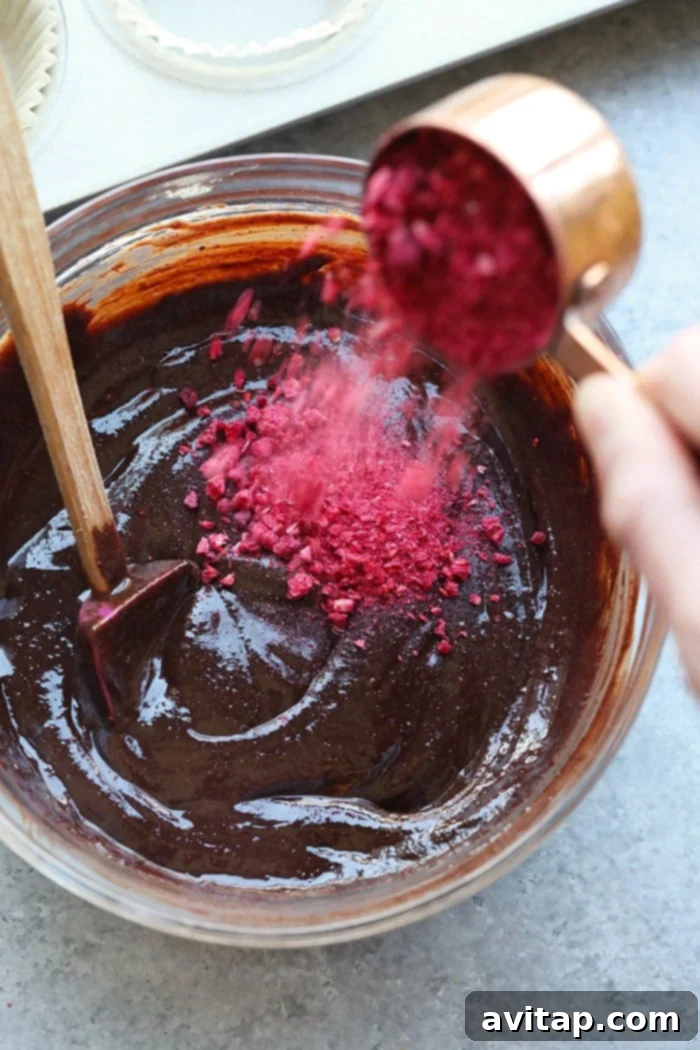 Close-up of the smooth, rich chocolate almond butter batter being prepared in a bowl before being scooped.