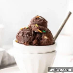 A delicious cup of chocolate protein ice cream, perfectly portioned and ready to eat.