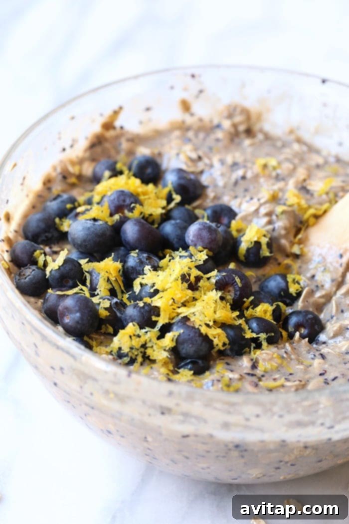 Bowl of Lemon Blueberry Vegan Baked Oatmeal, garnished with fresh blueberries